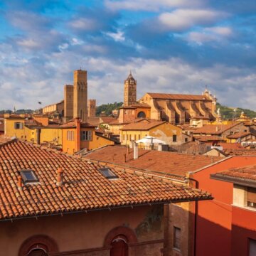 View of Bologna Cathedral and towers towering above of the roofs